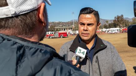 Asm. González being interviewed by reporter
