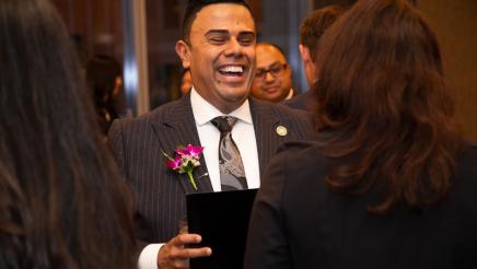 Asm. González sharing a light moment with attendee
