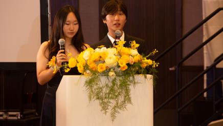 Honorees at podium, speaking