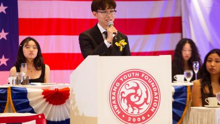 Honoree at podium, speaking