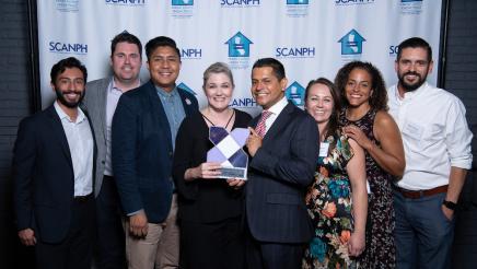 Assemblymember Miguel Santiago congratulates the 2019 SCANPH Advocate of the Year award recipient United Way of Greater Los Angeles Everyone in Campaign. United Way CEO, Elise Buik, is pictured receiving the award.